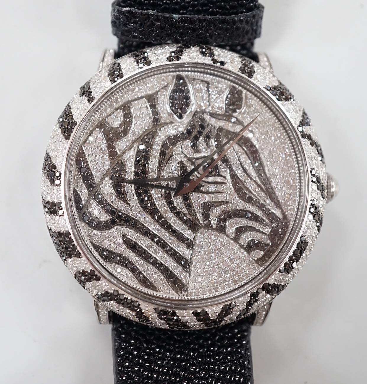 A gentleman's modern stainless steel and two colour diamond set limited edition Le Vian quartz wrist watch, the dial decorated with the head of a zebra, numbered 26/500, on a Le Vian leather strap, case diameter 44mm, no